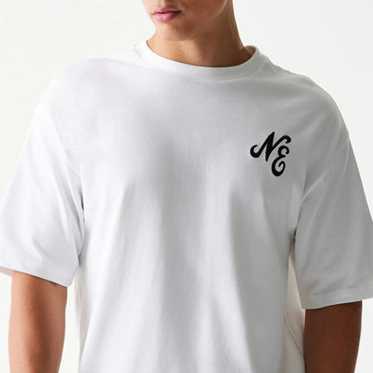 The model is wearing this New Era Floral Graphic Oversized T-Shirt in white. 5