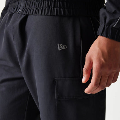 The model is wearing this MLB Utility New York Yankees Straight Leg Cargo Joggers in black. 5