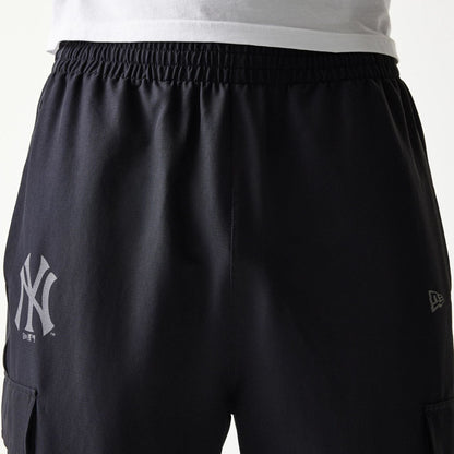The model is wearing this MLB Utility New York Yankees Straight Leg Cargo Joggers in black. 6