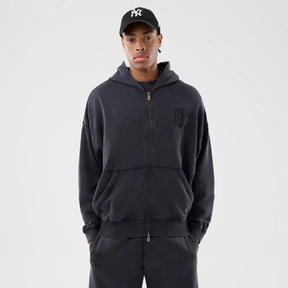 The model is wearing this MLB Washed New York Yankees Full Zip Hoodie in black. 1