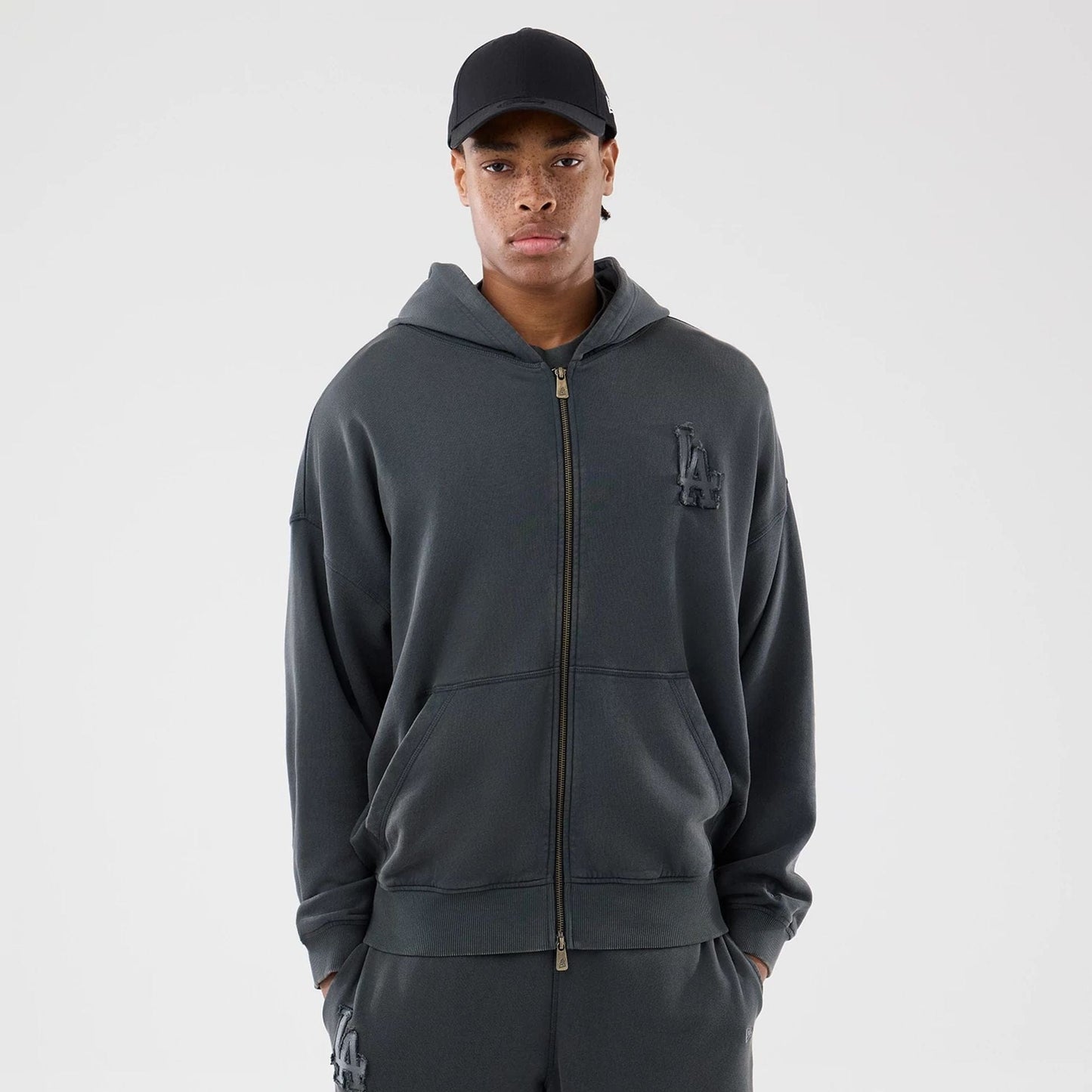 The model is wearing this MLB Washed LA Dodgers Full Zip Hoodie in Dark Grey. 1