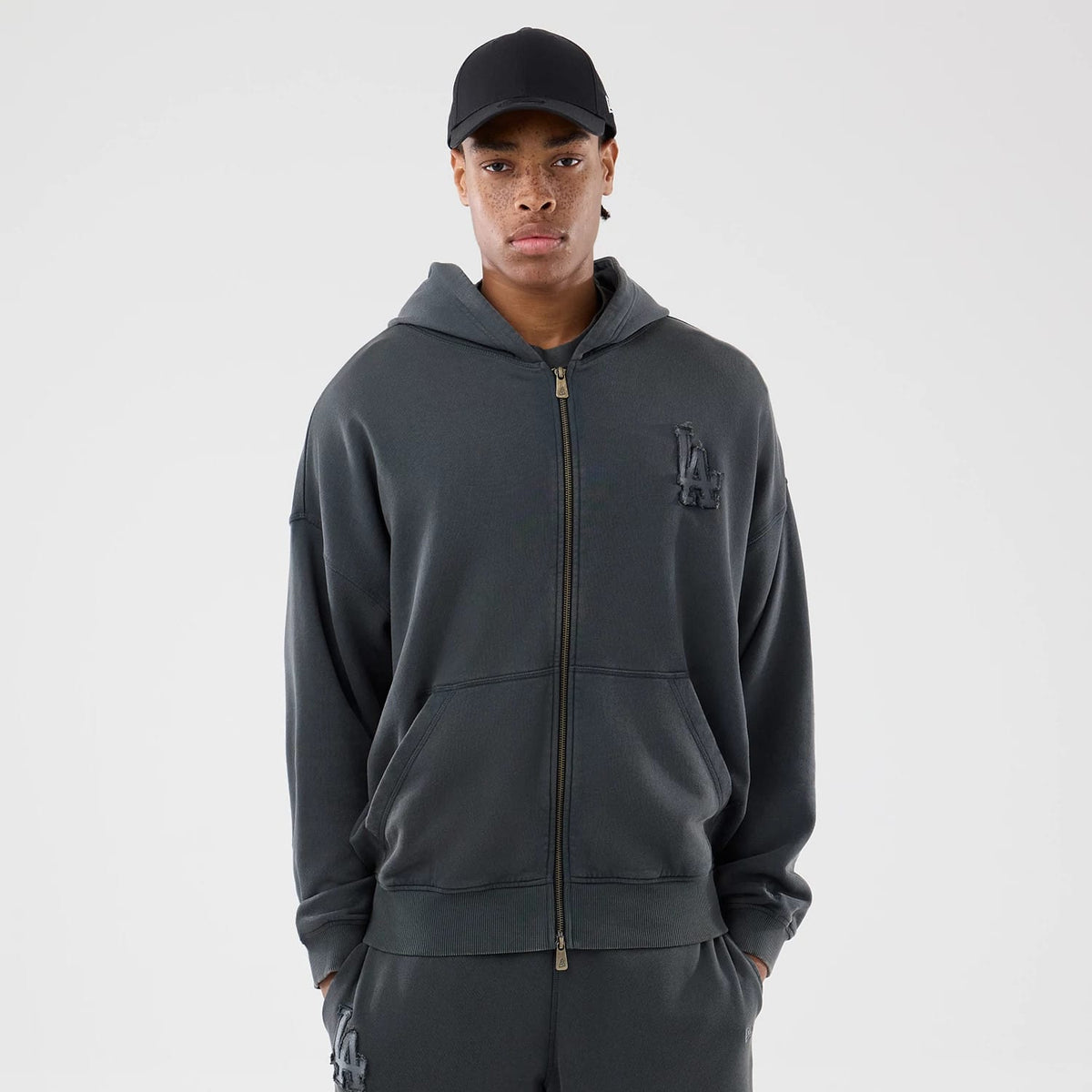 The model is wearing this MLB Washed LA Dodgers Full Zip Hoodie in Dark Grey. 1