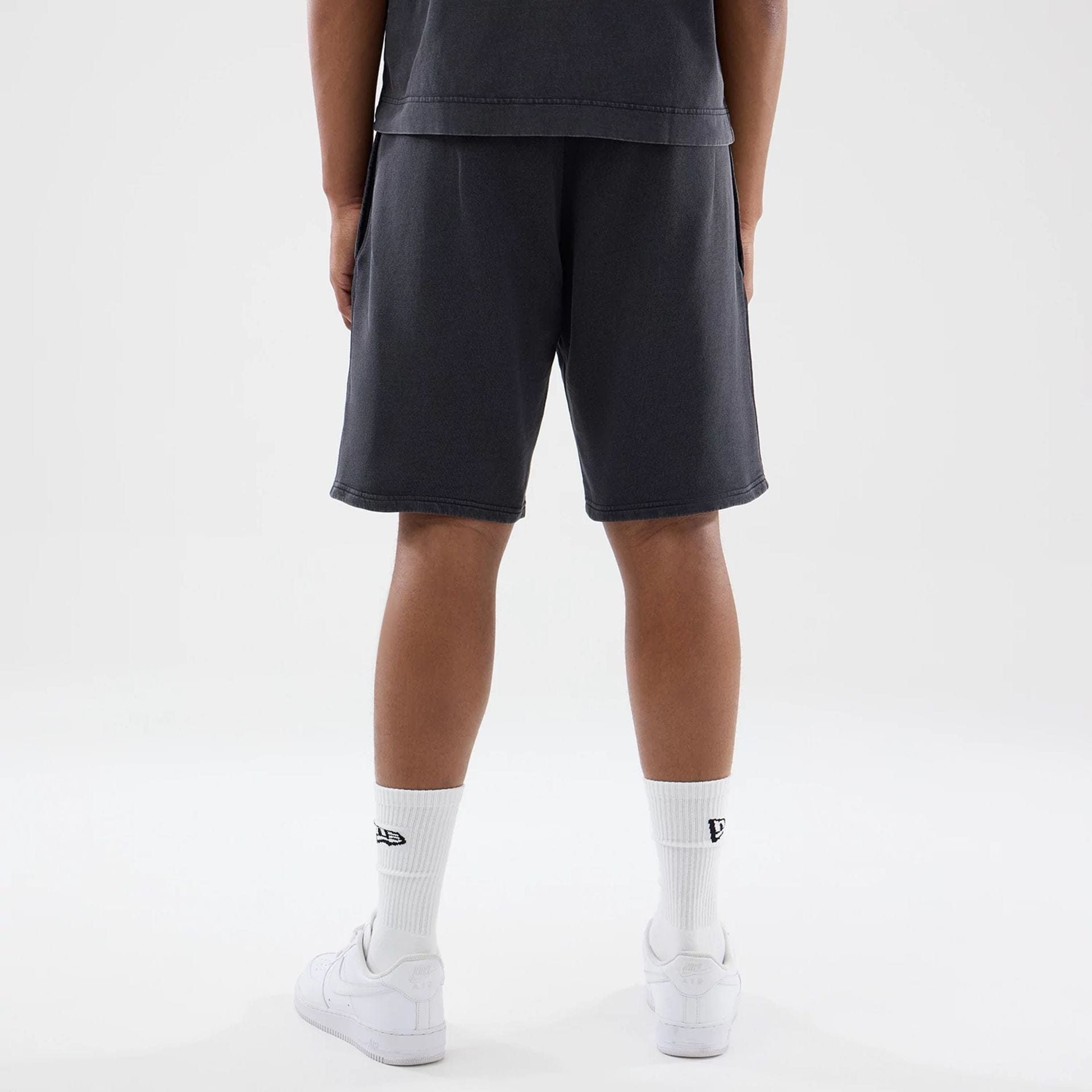 The model is wearing this MLB Washed New York Yankees Shorts in black. 2