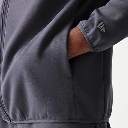 The model is wearing this MLB New York Yankees Full Zip Hoodie in dark grey. 5