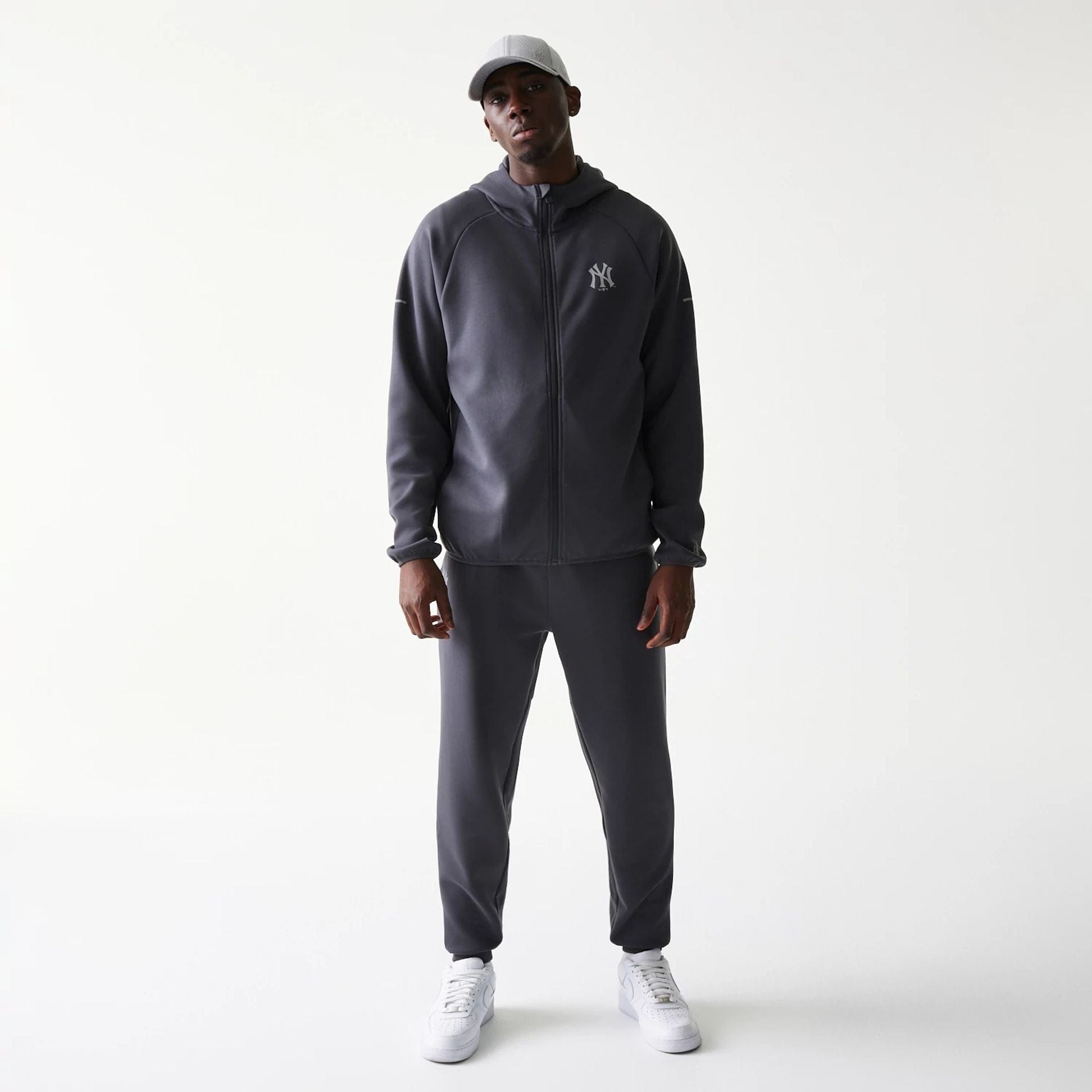 The model is wearing this MLB New York Yankees Full Zip Hoodie in dark grey. 8