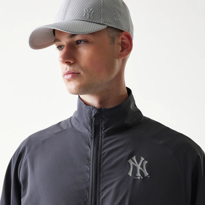 The model is wearing this MLB New York Yankees Jacket in dark grey. 4