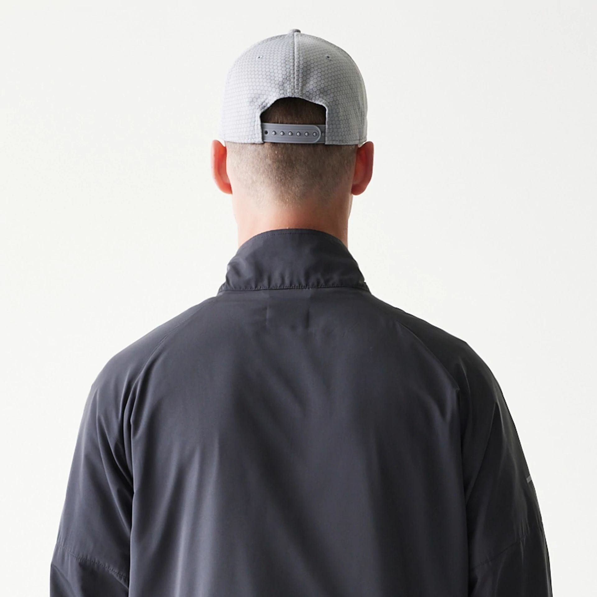 The model is wearing this MLB New York Yankees Jacket in dark grey. 7