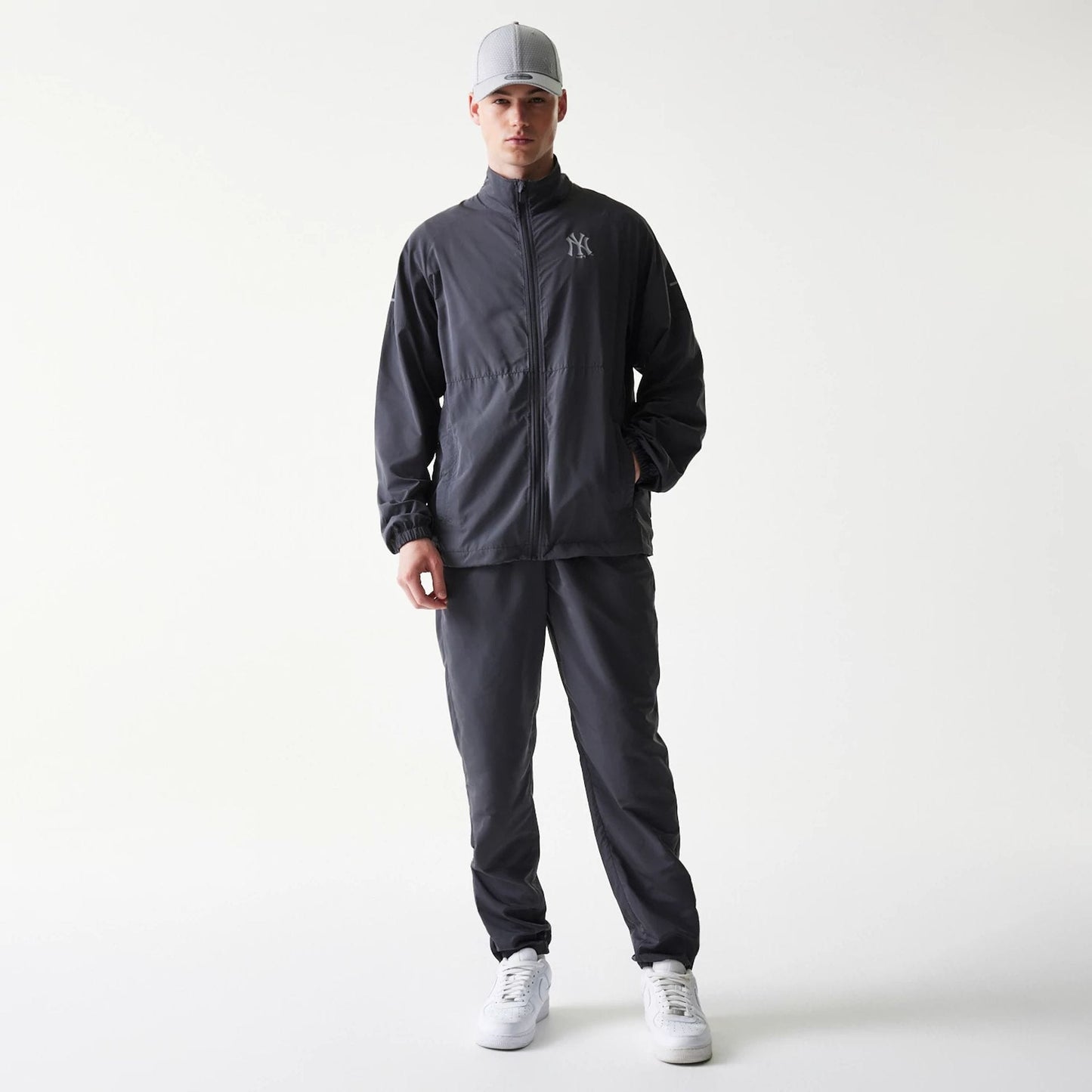 The model is wearing this MLB New York Yankees Jacket in dark grey. 8
