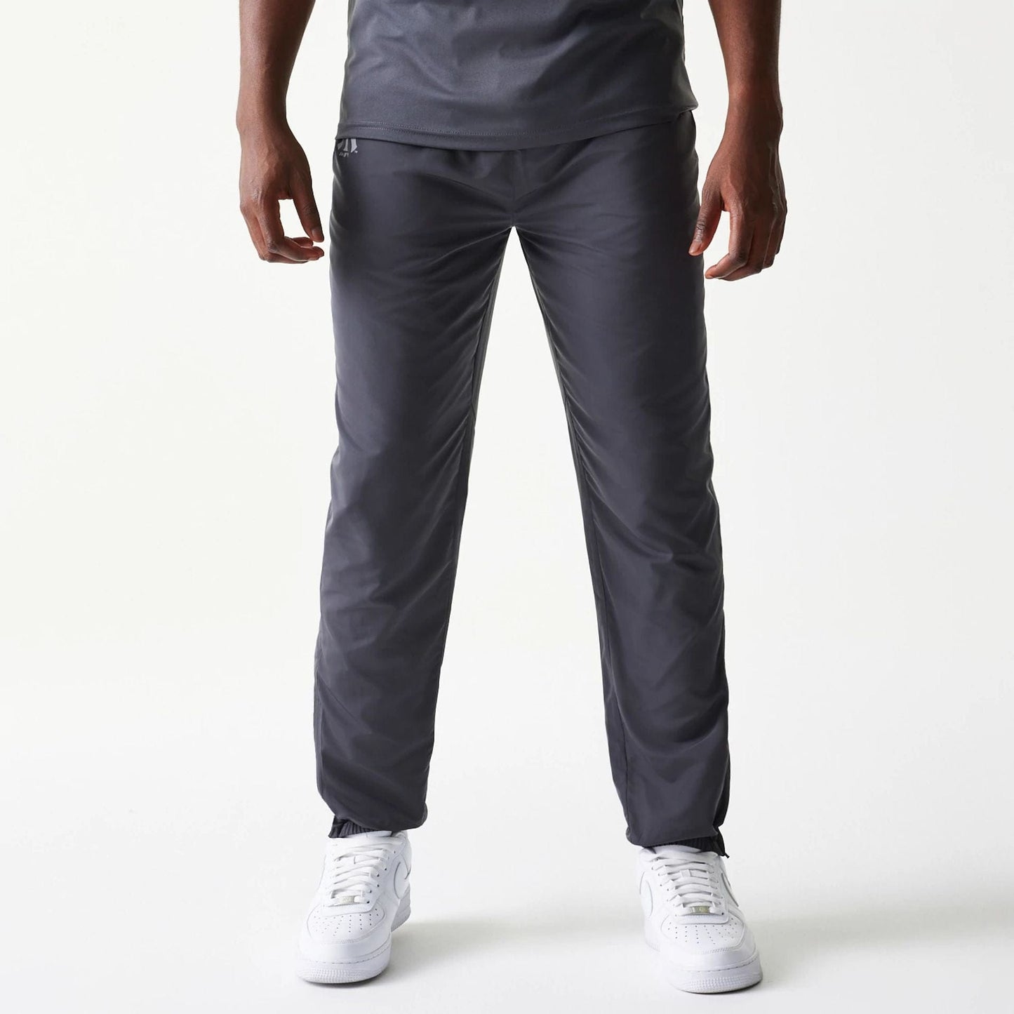 The model is wearing this MLB New York Yankees Track Pants in dark grey. 1