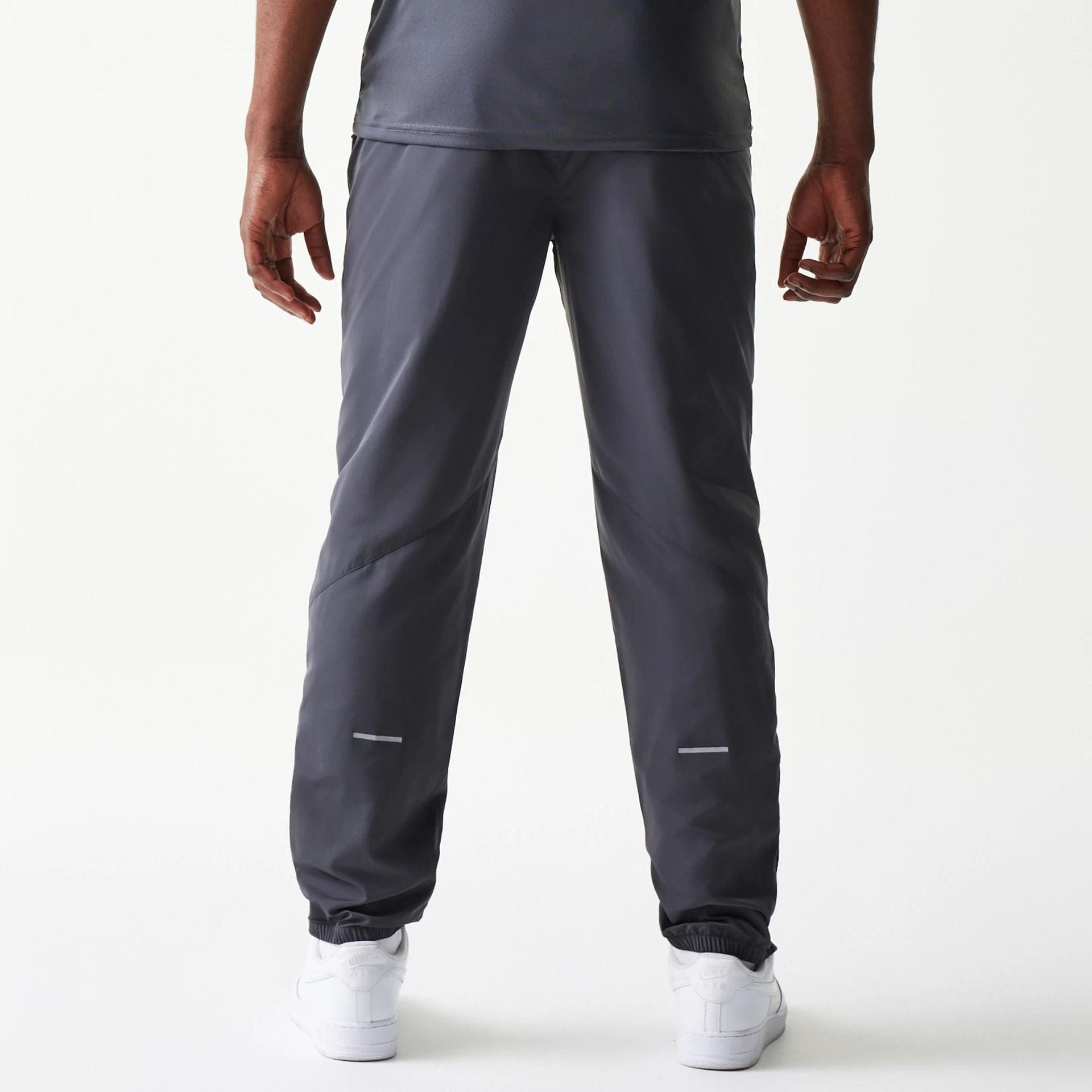 The model is wearing this MLB New York Yankees Track Pants in dark grey. 2