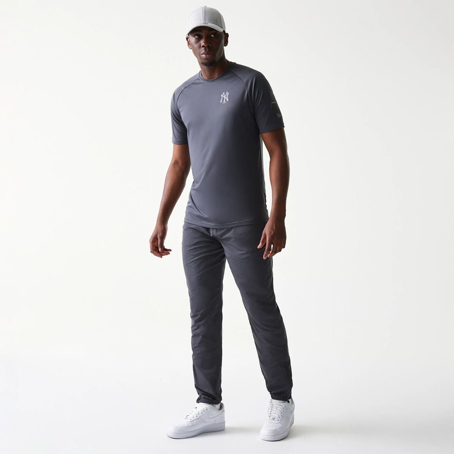 The model is wearing this MLB New York Yankees Track Pants in dark grey. 8