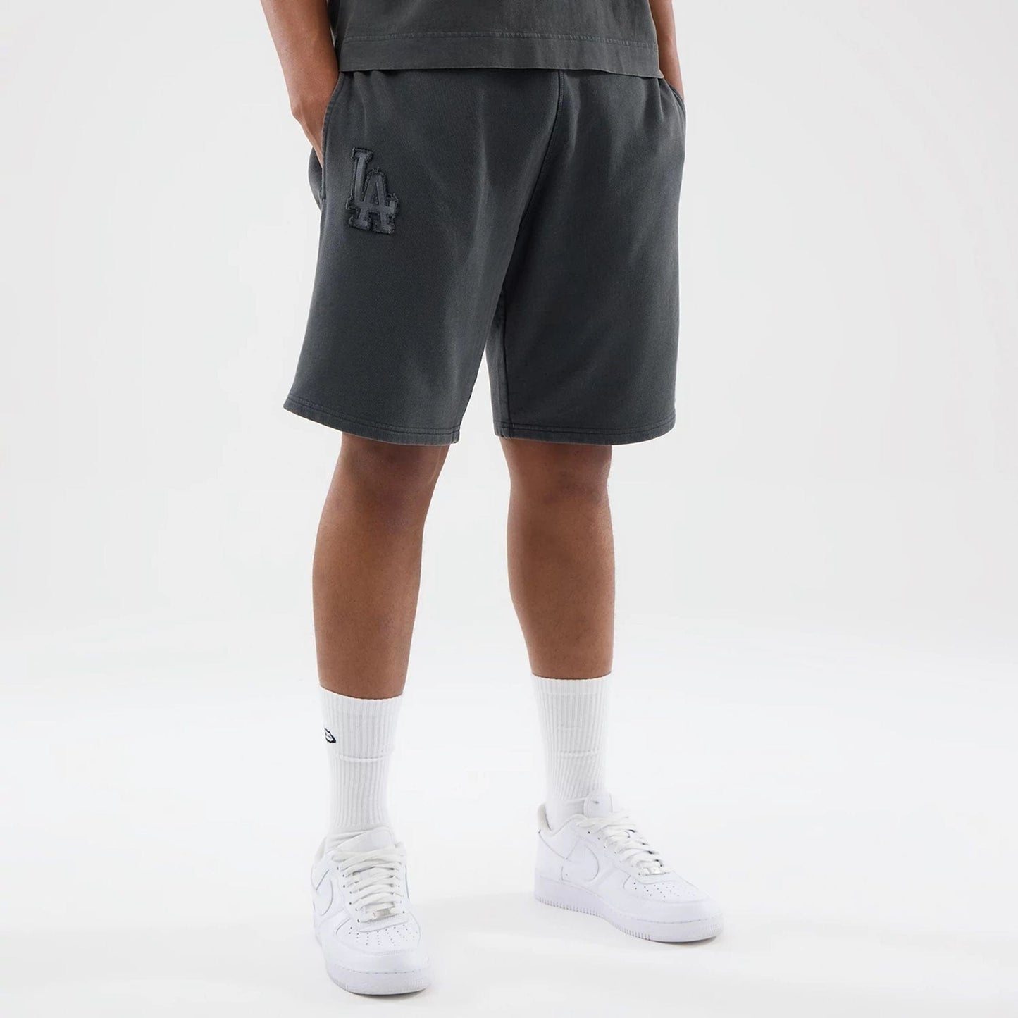 The model is wearing this MLB Washed LA Dodgers Shorts in Dark Grey. 7