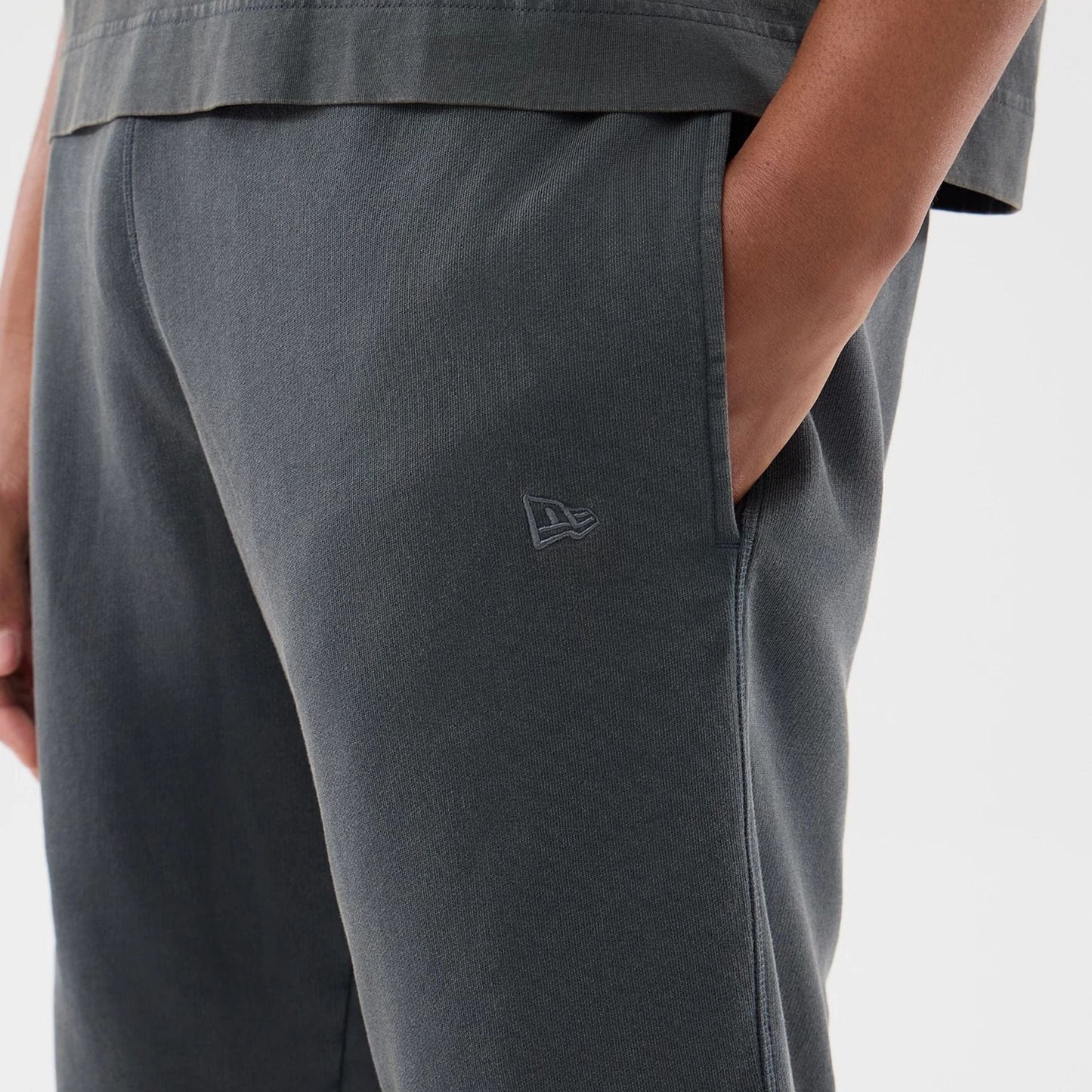 The model is wearing this MLB Washed LA Dodgers Shorts in Dark Grey. 4