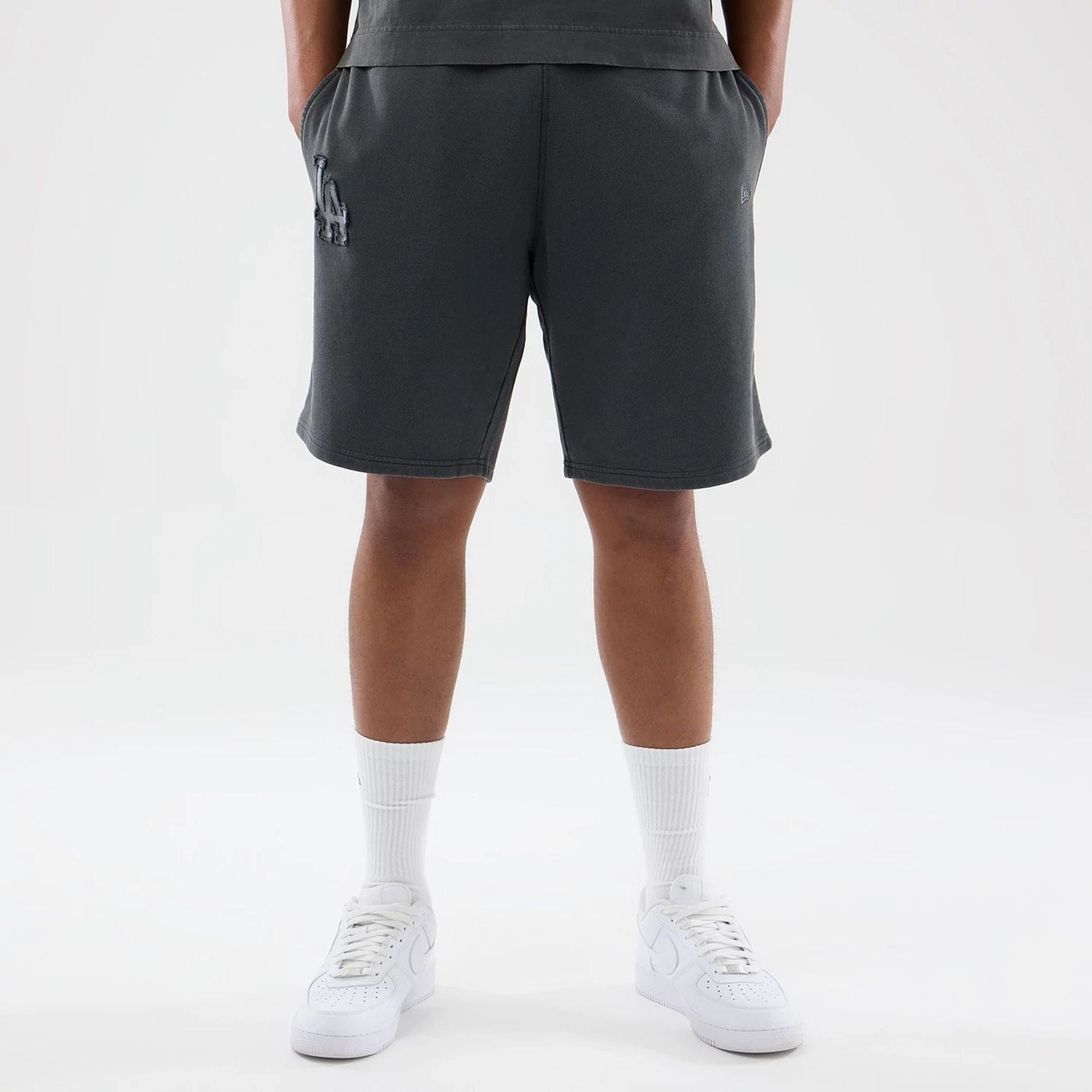 The model is wearing this MLB Washed LA Dodgers Shorts in Dark Grey. 1