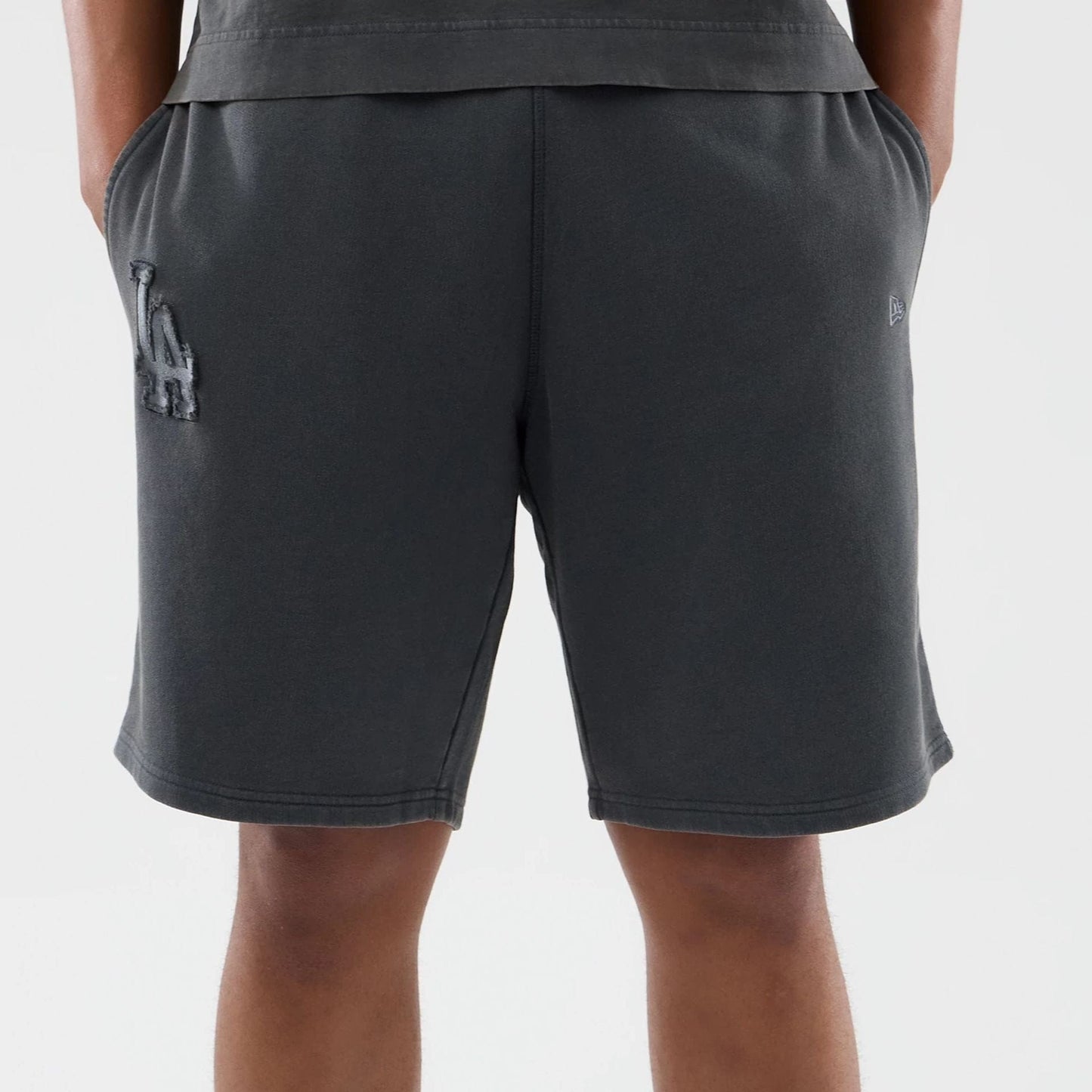 The model is wearing this MLB Washed LA Dodgers Shorts in Dark Grey. 5