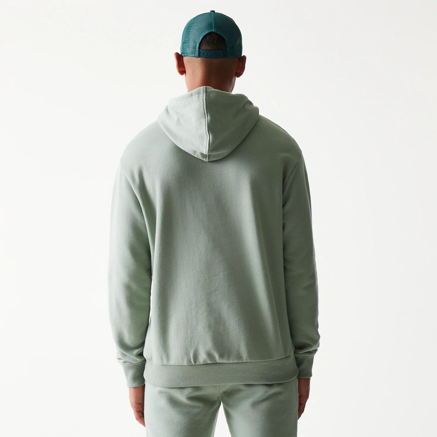 The model is wearing this MLB League Essential Midi LA Dodgers Oversized Pullover Hoodie in pastel green. 2