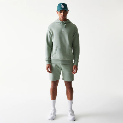 The model is wearing this MLB League Essential Midi LA Dodgers Oversized Pullover Hoodie in pastel green. 8