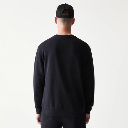 The model is wearing this NBA League Essential Chicago Bulls Oversized Crew Neck Sweater in black. 2