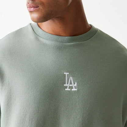 The model is wearing this MLB League Essential Midi LA Dodgers Oversized Crew Neck Sweater in pastel green. 4