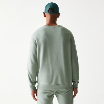 The model is wearing this MLB League Essential Midi LA Dodgers Oversized Crew Neck Sweater in pastel green. 2