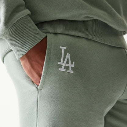 The model is wearing this MLB League Essential Midi LA Dodgers Shorts in pastel green. 3