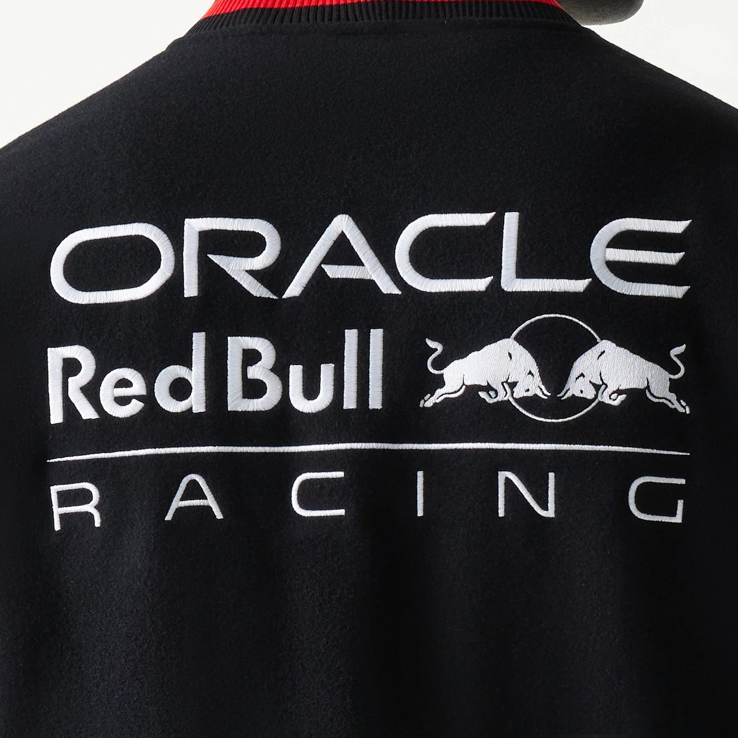 The model is wearing this Red Bull Racing Varsity Jacket in black. 6