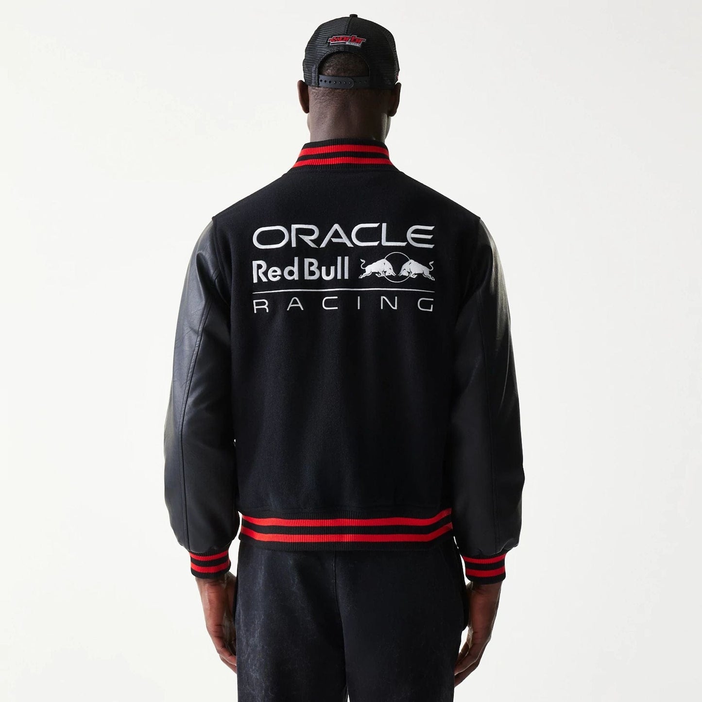 The model is wearing this Red Bull Racing Varsity Jacket in black. 2