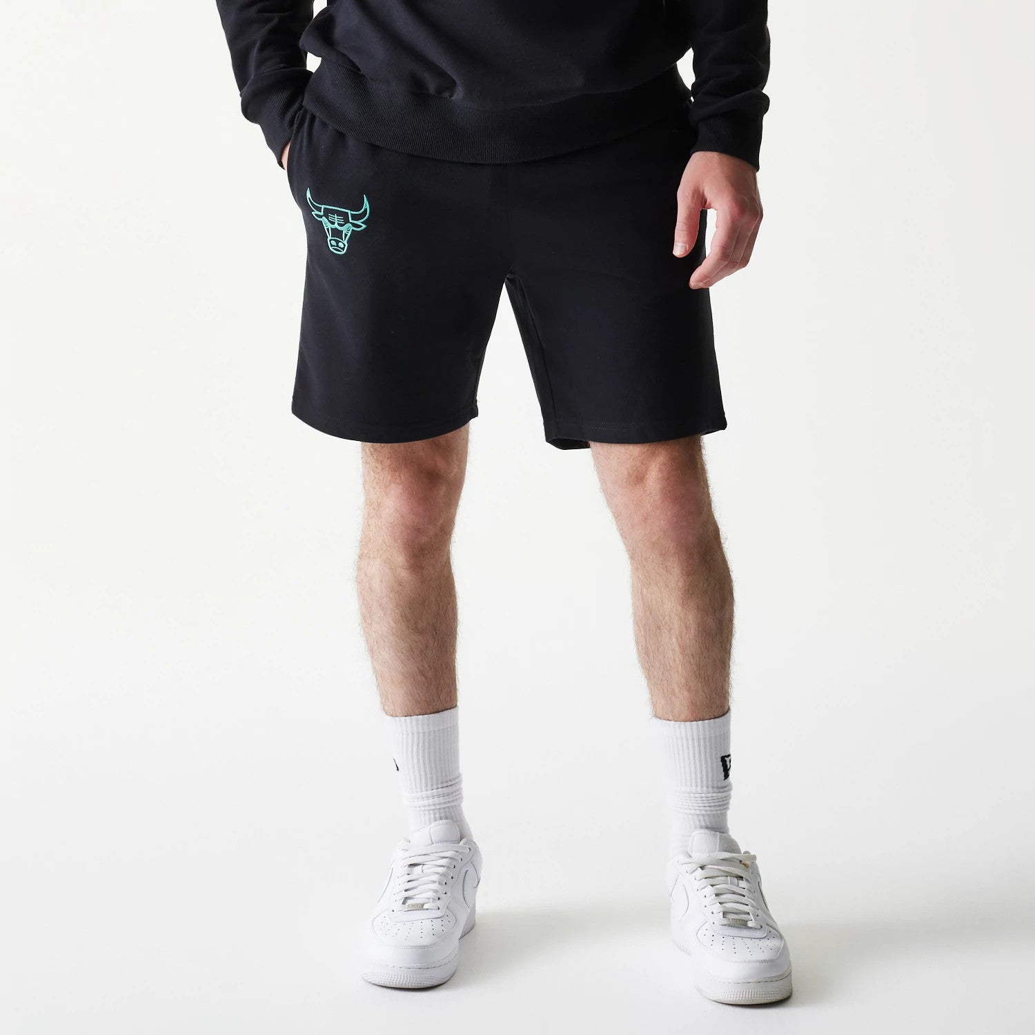 The model is wearing this NBA Core Chicago Bulls Shorts in black. 1