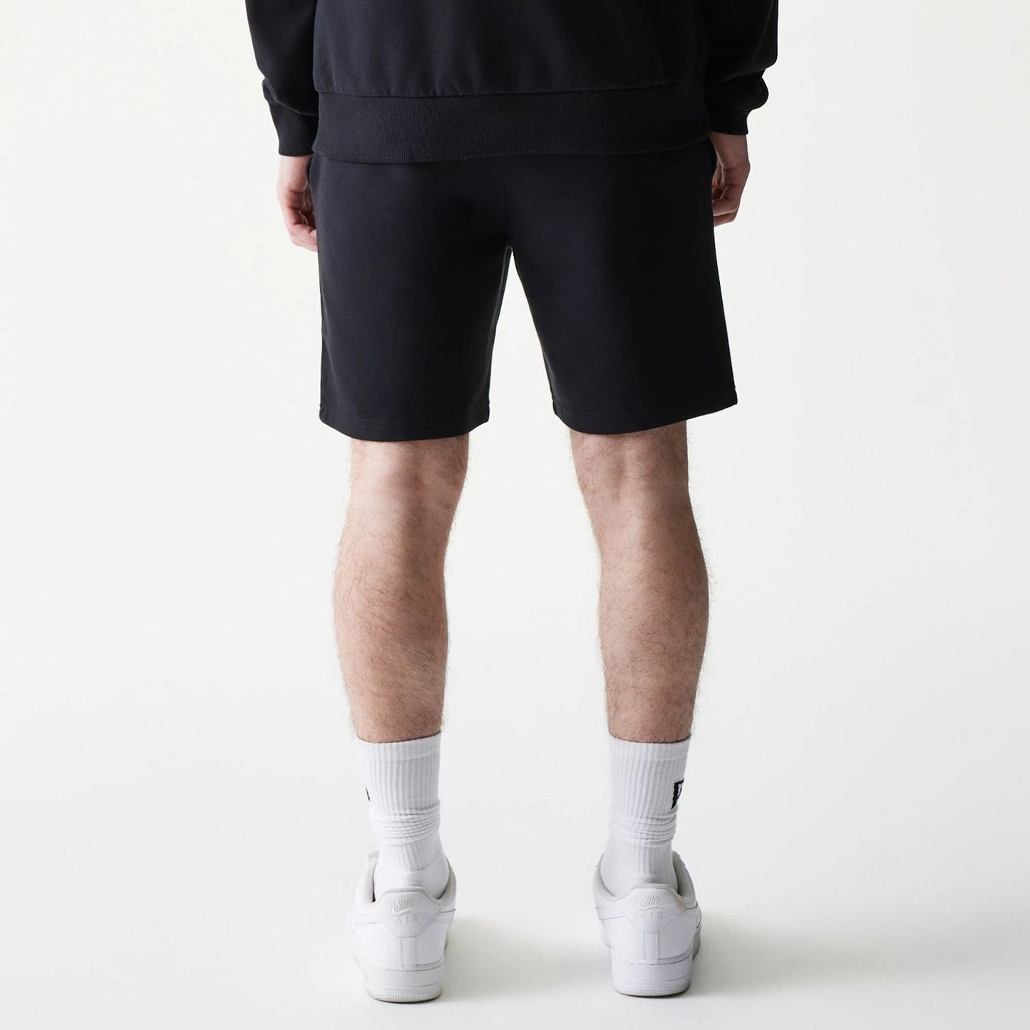 The model is wearing this NBA League Essential Chicago Bulls Shorts in black. 2