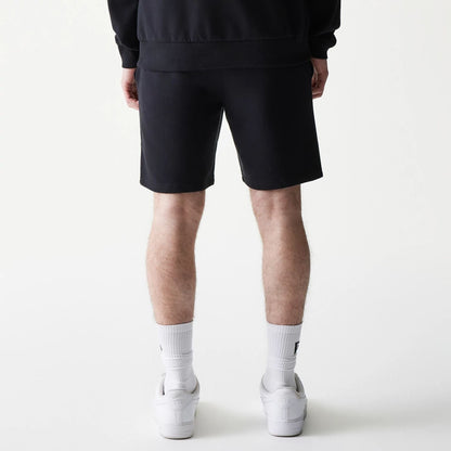 The model is wearing this NBA League Essential Chicago Bulls Shorts in black. 2