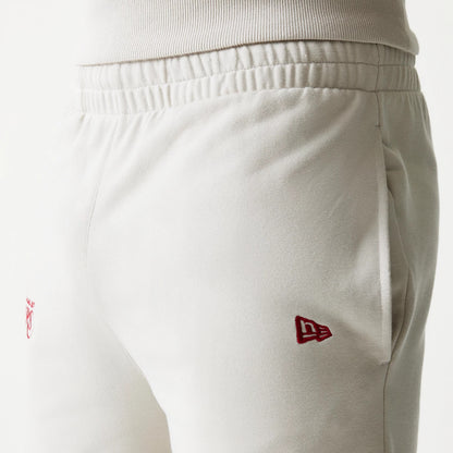 The model is wearing this NBA League Essential LA Lakers Shorts in light beige. 5