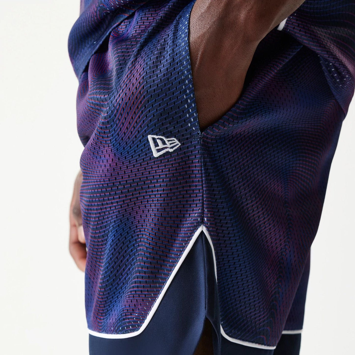 The model is wearing this Red Bull Racing Oversized Mesh Shorts in dark blue. 5
