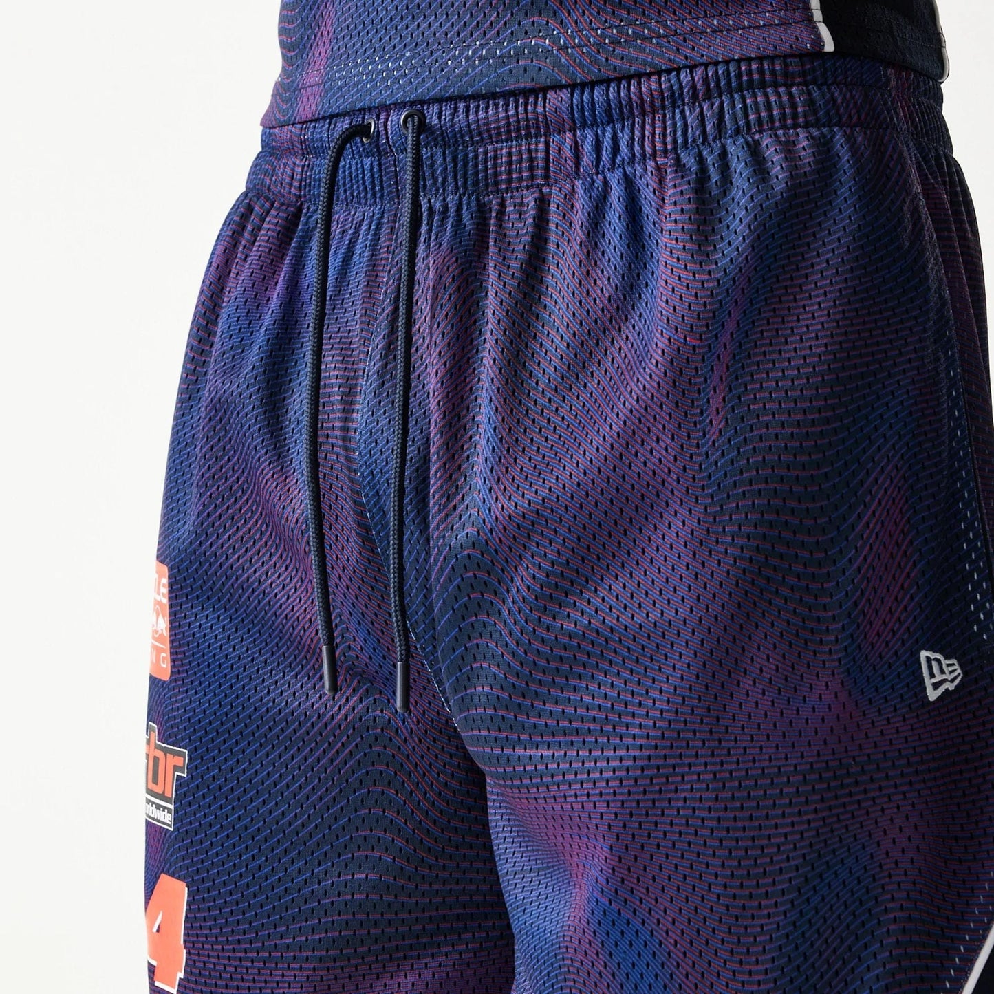 The model is wearing this Red Bull Racing Oversized Mesh Shorts in dark blue. 4