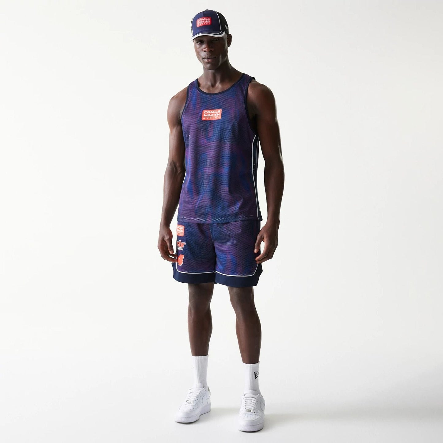 The model is wearing this Red Bull Racing Oversized Mesh Shorts in dark blue. 8