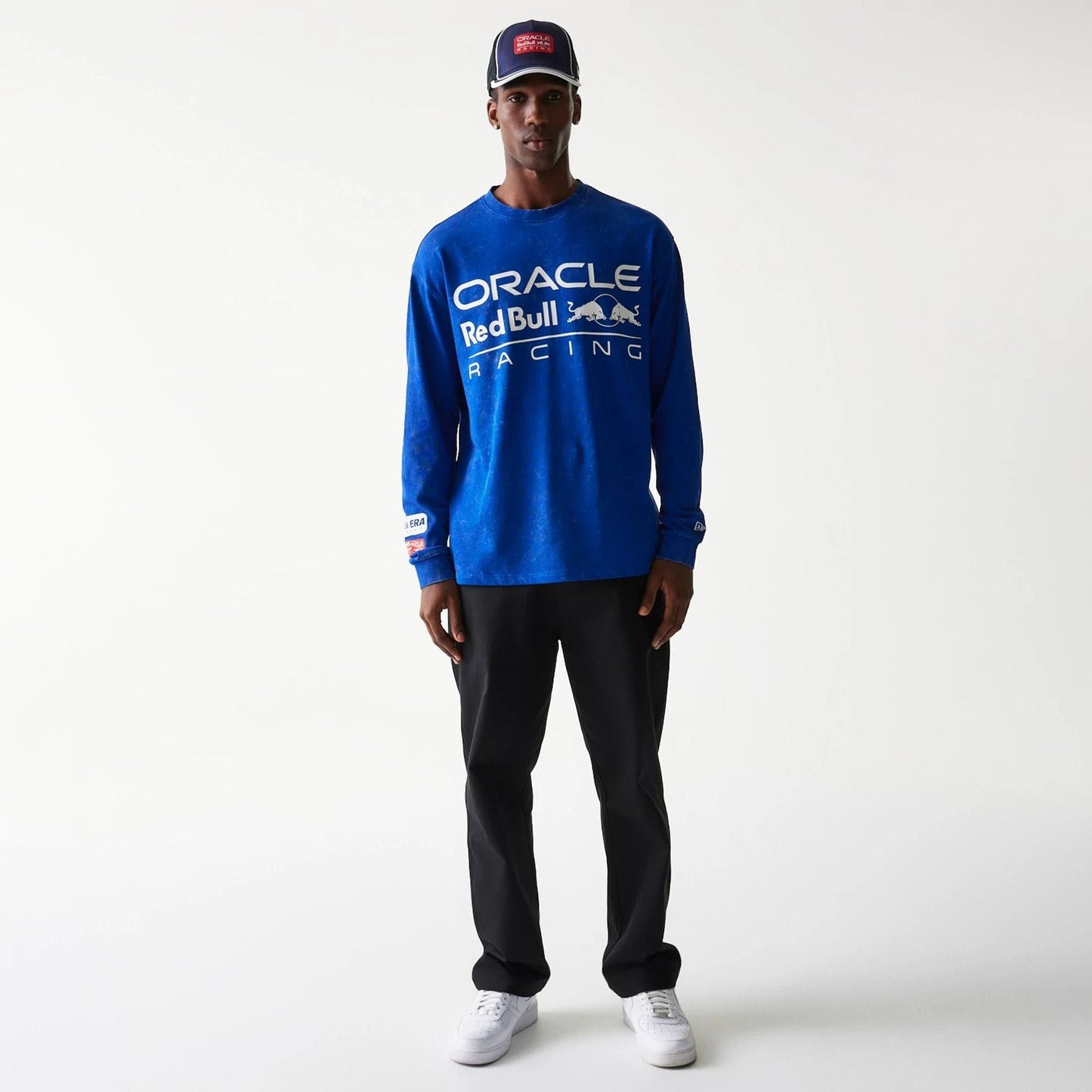 The model is wearing this Red Bull Racing Linear Graphic Long Sleeve T-Shirt in blue. 8