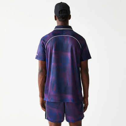 New Era Red Bull Racing All Over Print Dark Blue Football T-Shirt, back view on a model showing the dark blue and purple pattern with light piping detail across the shoulders and sleeves, paired with matching shorts.