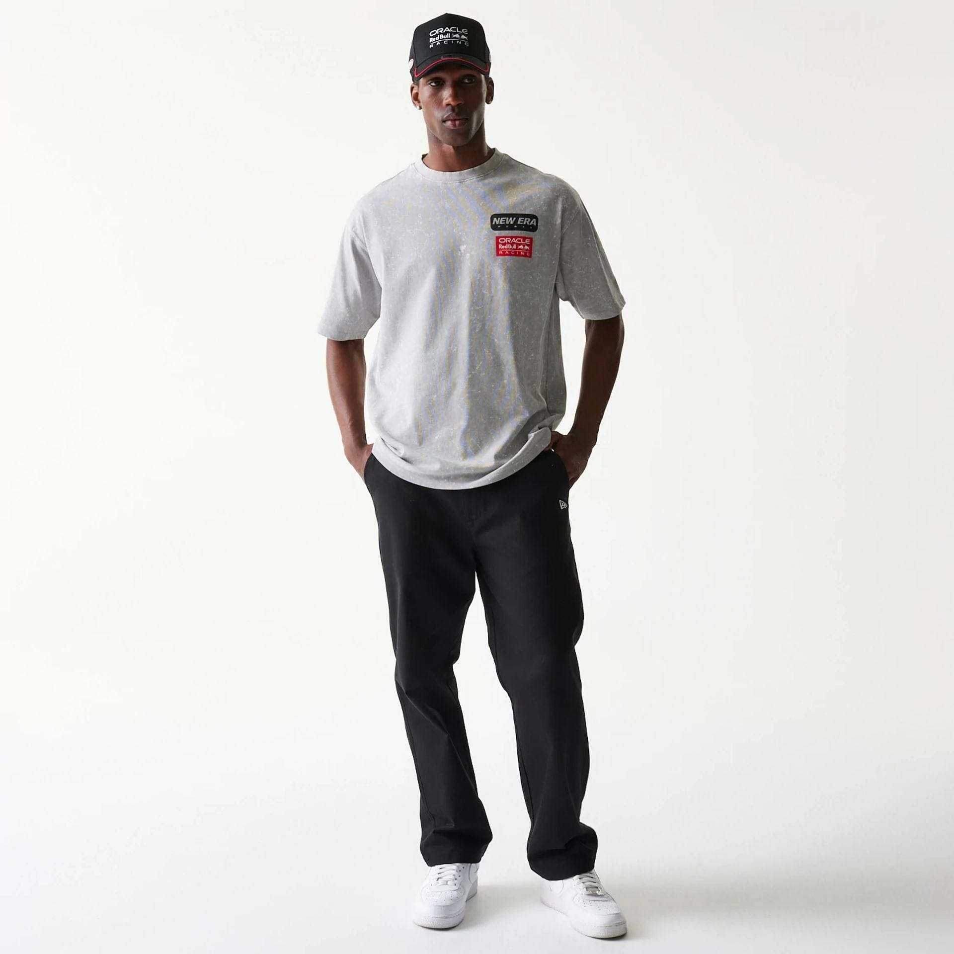The model is wearing this Red Bull Racing Linear Graphic Oversized T-Shirt in grey. 8