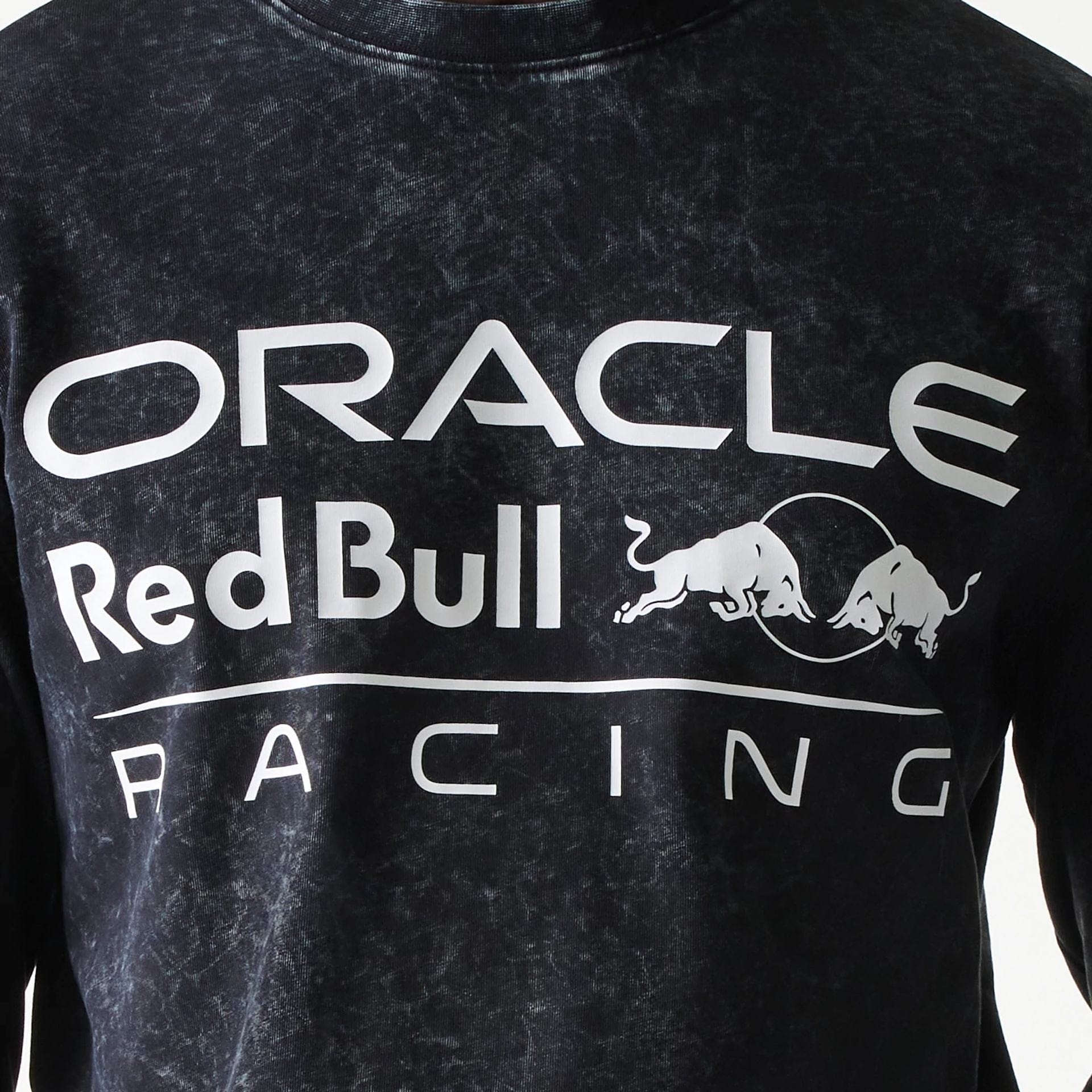 The model is wearing this Red Bull Racing Linear Graphic Long Sleeve T-Shirt in black. 7