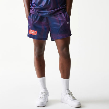 The model is wearing this Red Bull Racing All Over Print Football Shorts in dark blue. 1