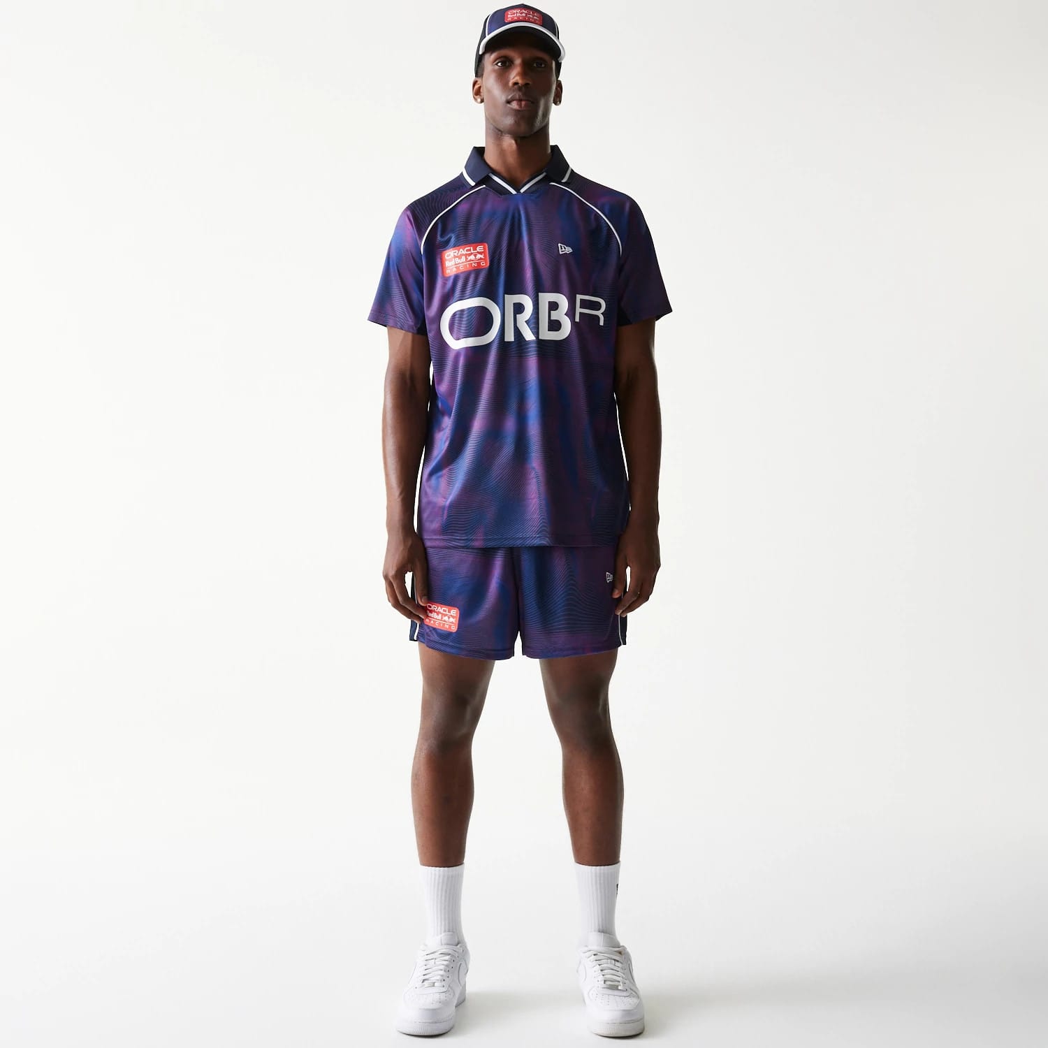 The model is wearing this Red Bull Racing All Over Print Football Shorts in dark blue. 8