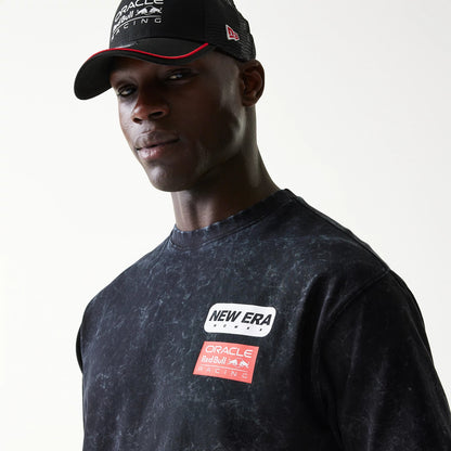 The model is wearing this Red Bull Racing Linear Graphic Oversized T-Shirt in black. 4