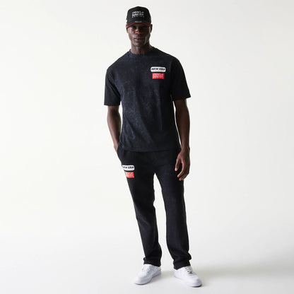 The model is wearing this Red Bull Racing Linear Graphic Oversized T-Shirt in black. 8