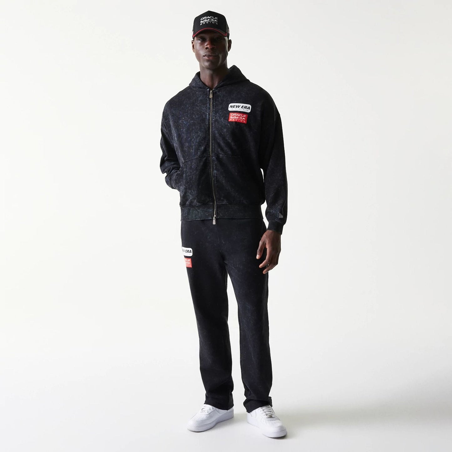 The model is wearing this Red Bull Racing Dropped Shoulder Full Zip Hoodie in black. 8