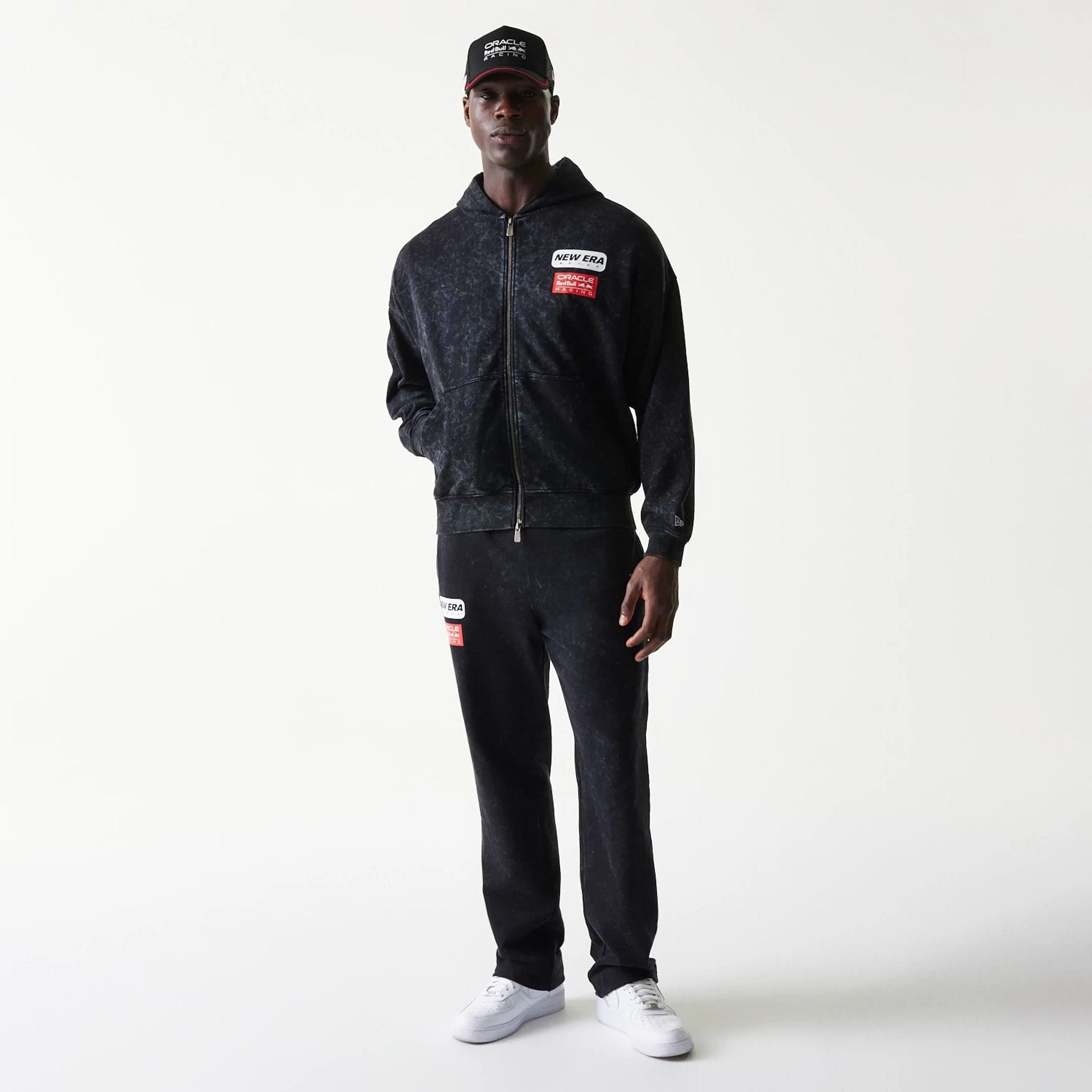 The model is wearing this Red Bull Racing Dropped Shoulder Full Zip Hoodie in black. 8