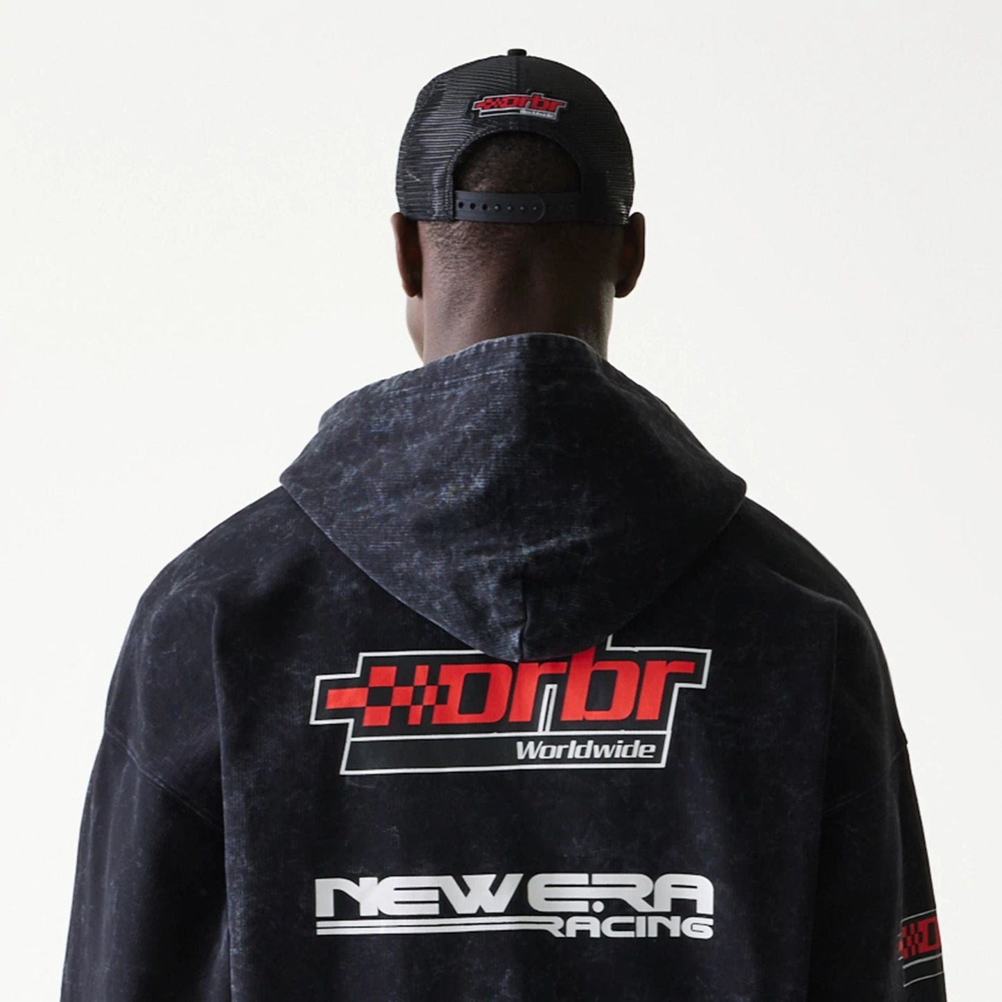 The model is wearing this Red Bull Racing Graphic Dropped Shoulder Full Zip Hoodie in black. 4