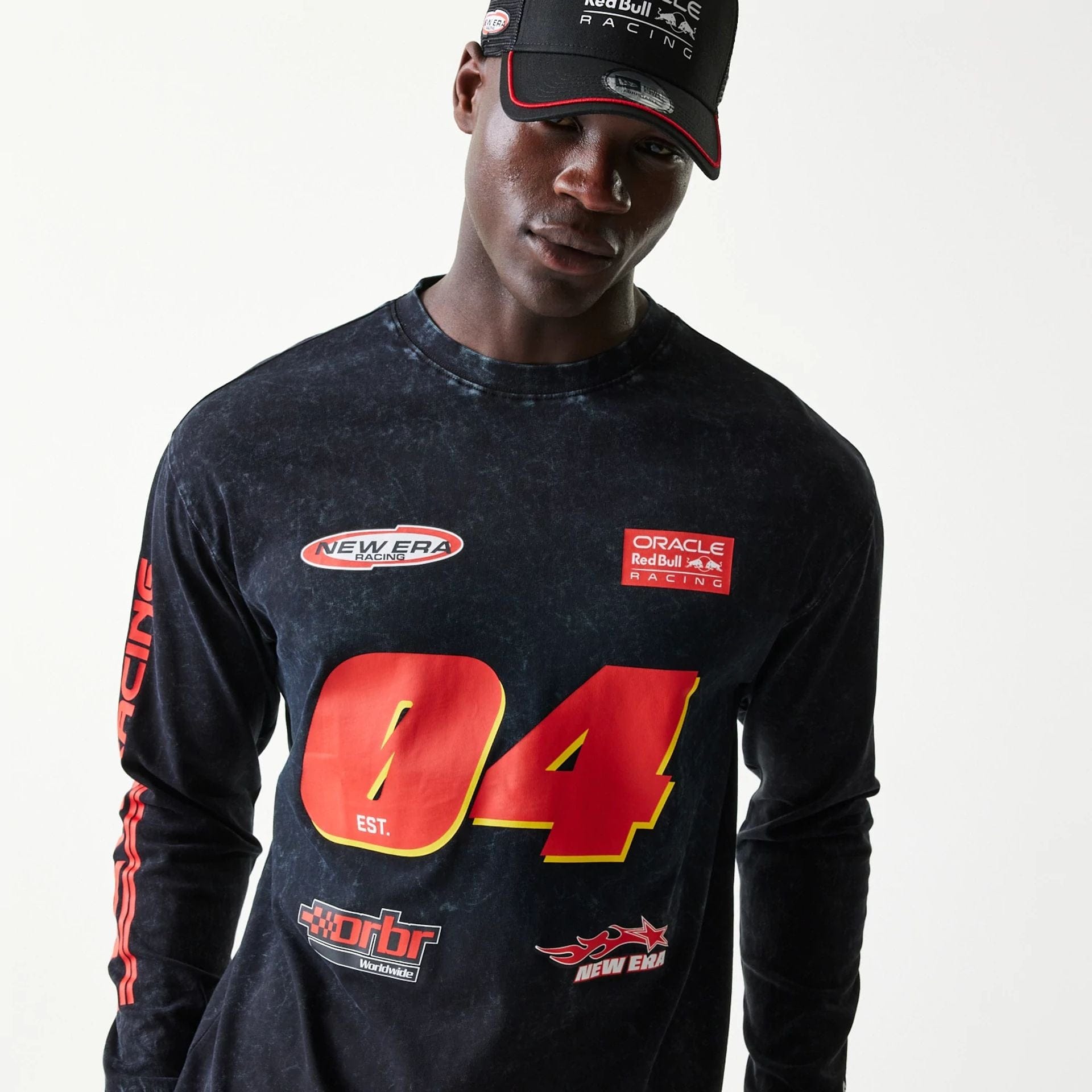 The model is wearing this Red Bull Racing Graphic Long Sleeve T-Shirt in black. 3