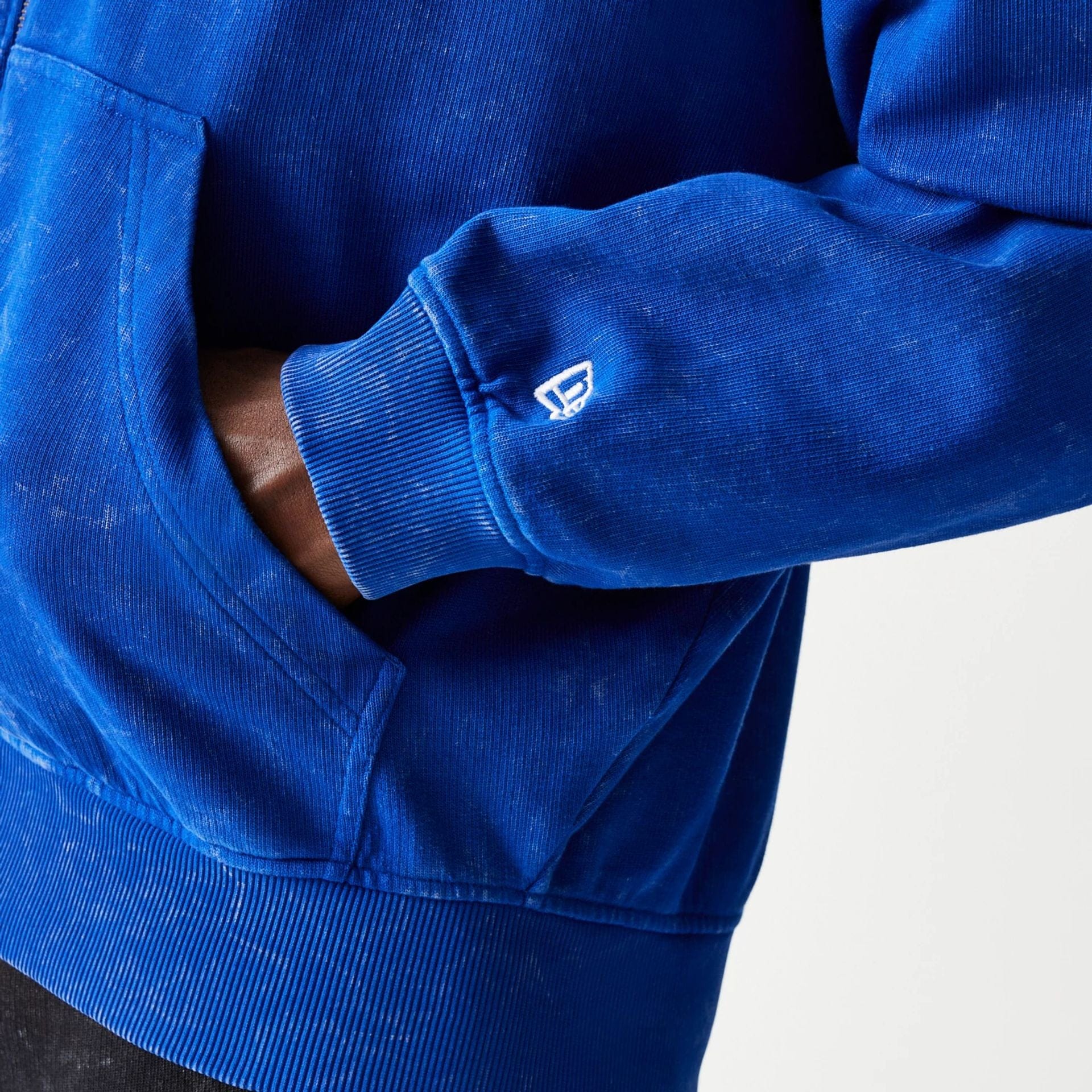 The model is wearing this Red Bull Racing Graphic Dropped Shoulder Full Zip Hoodie in blue. 5