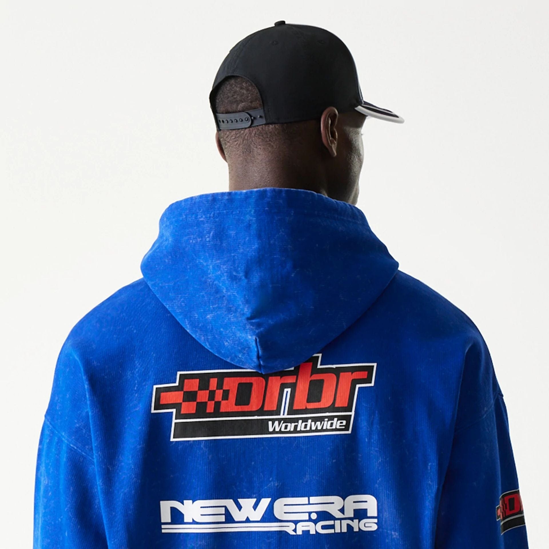 The model is wearing this Red Bull Racing Graphic Dropped Shoulder Full Zip Hoodie in blue. 7