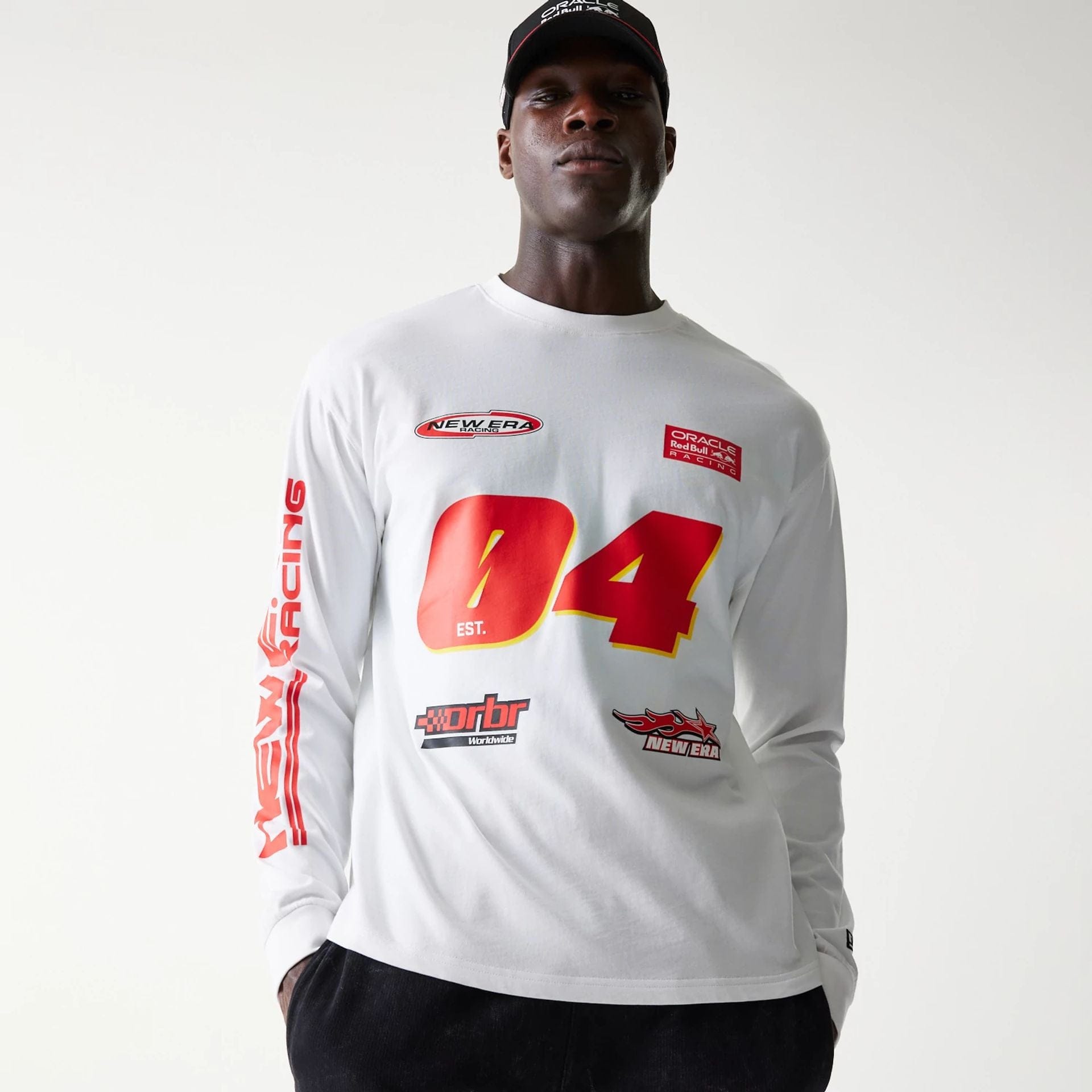 The model is wearing this Red Bull Racing Graphic Long Sleeve T-Shirt in white. 5