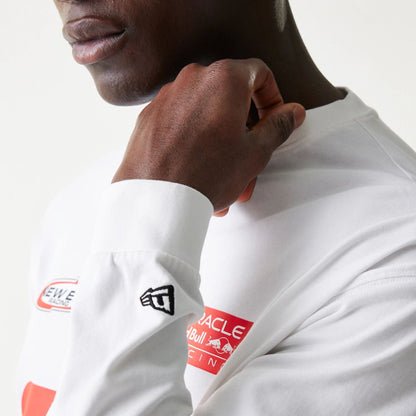 The model is wearing this Red Bull Racing Graphic Long Sleeve T-Shirt in white. 8